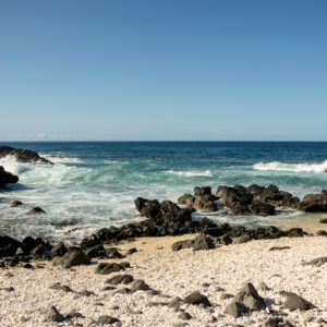 Waves Crashing On A Sandy Shoreline