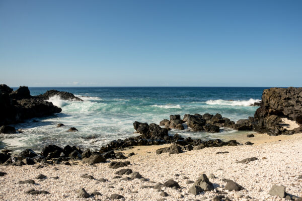 Waves Crashing On A Sandy Shoreline