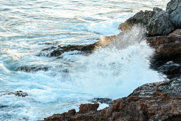 Waves Crashing Into Hawaii's Rocky Coastline